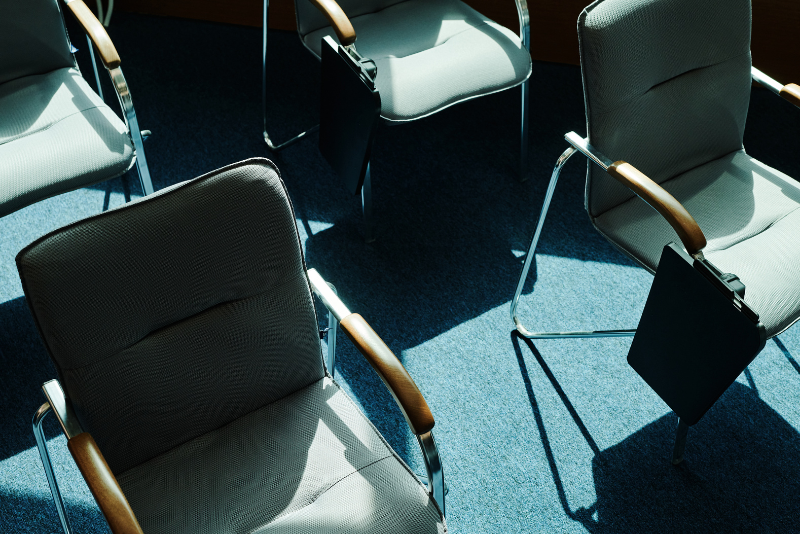 rows of chairs in an empty conference room